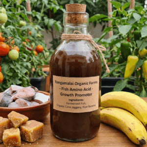 Rangamalai Organic Farms Fish Amino Acid growth promoter bottle displayed with fresh fish, organic cane jaggery, and ripe bananas in a natural farm setting.
